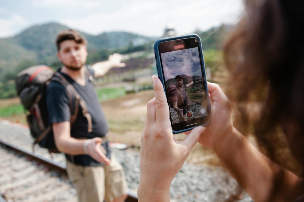 A couple vlogs their scenic railway adventure journey through picturesque countryside.
